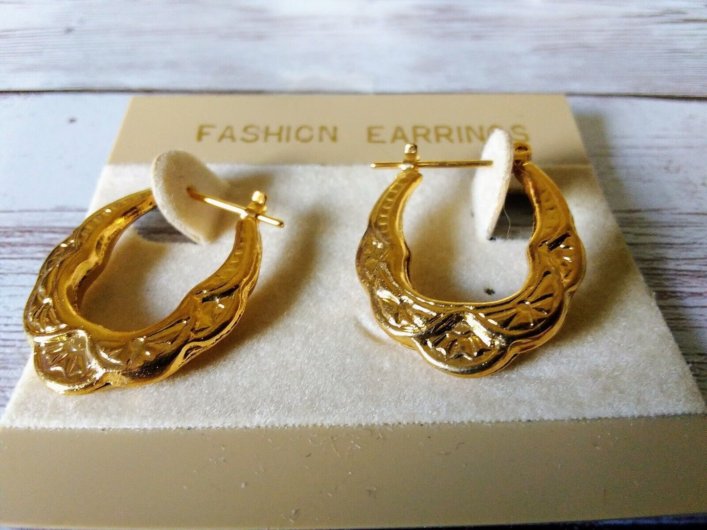 elegant gold hoop earrings with arch pattern