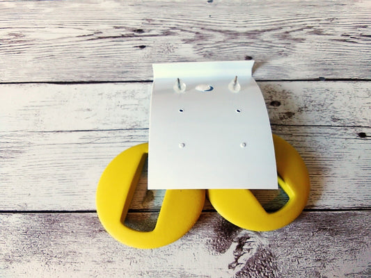 Back of earring card for Stylish bright yellow O-ring earrings with a retro vibe