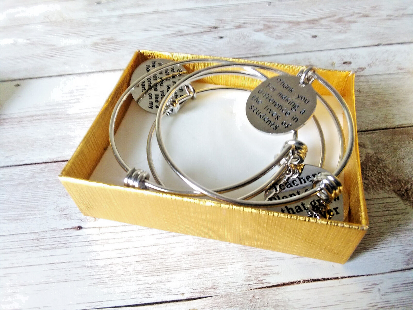 Teacher charm bracelets with "Helping me grow" engraved charm