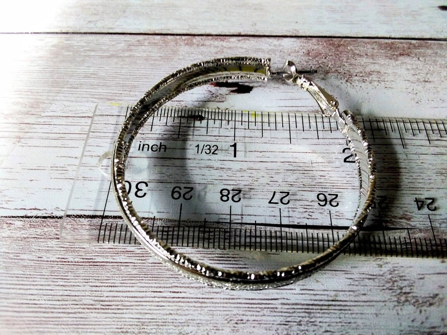 Gleaming extra-large silver hoops with high shine