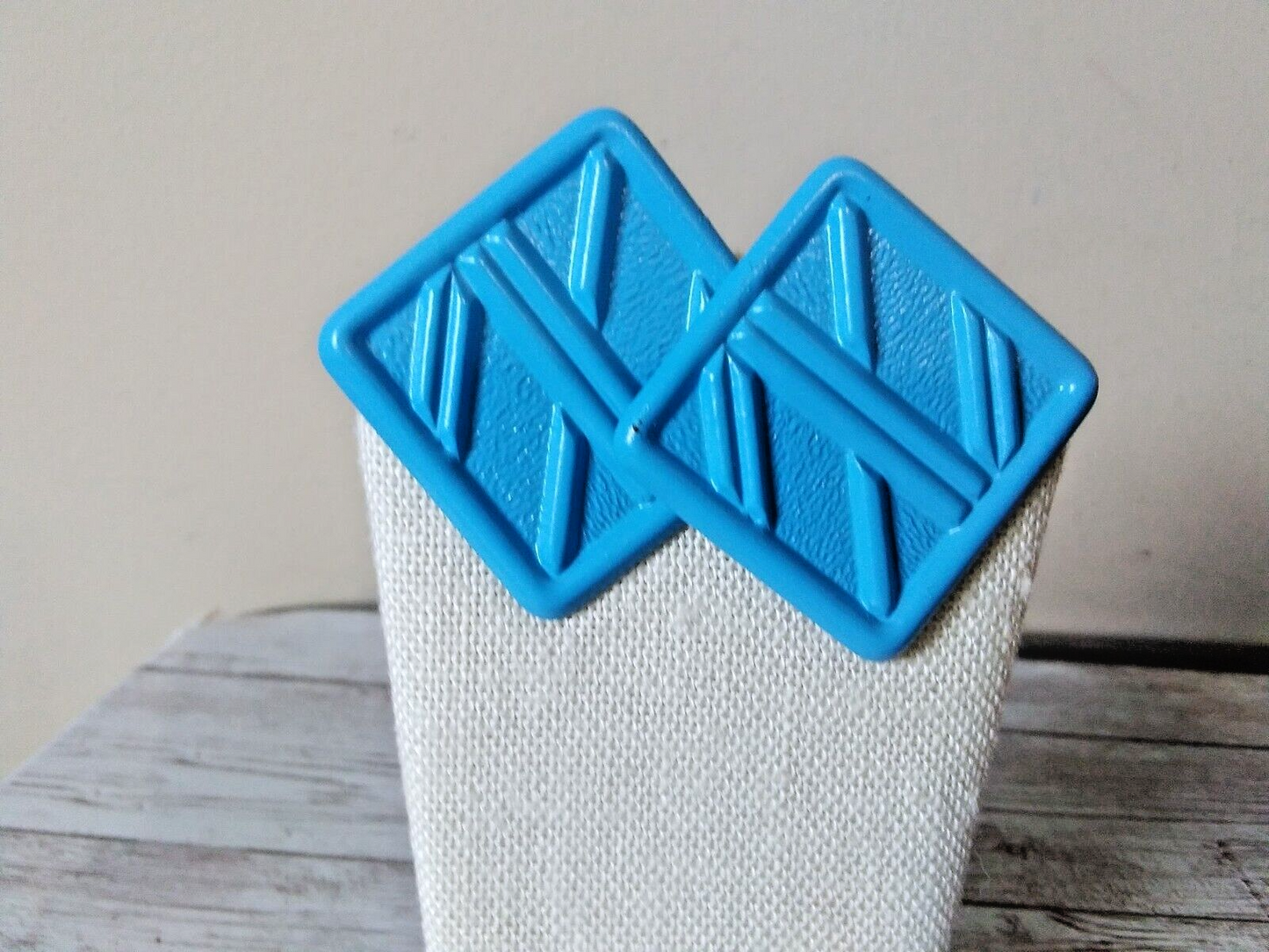 Detail of retro bright blue square earrings