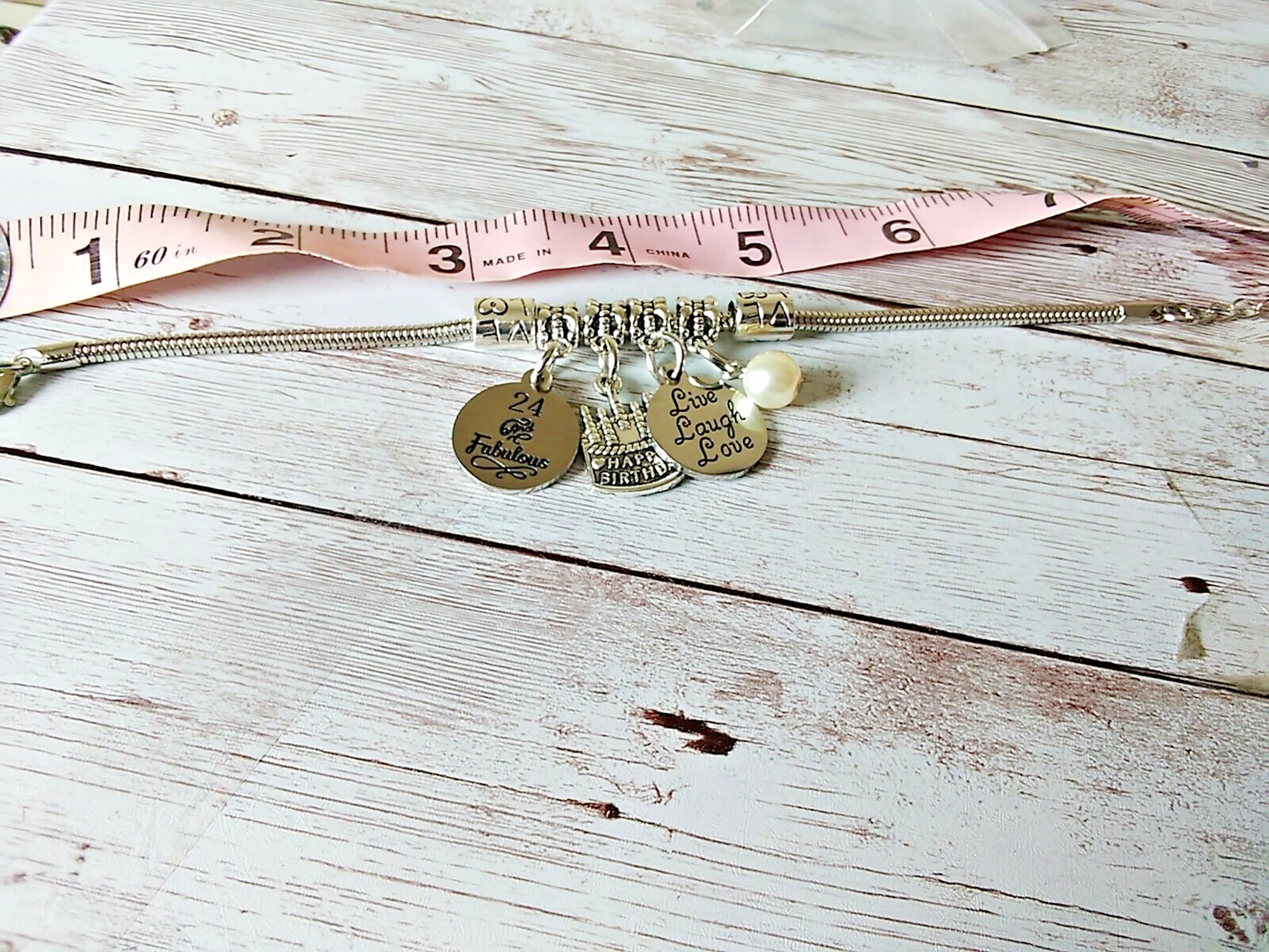 Adjustable stainless steel bracelet with birthday cake charm
