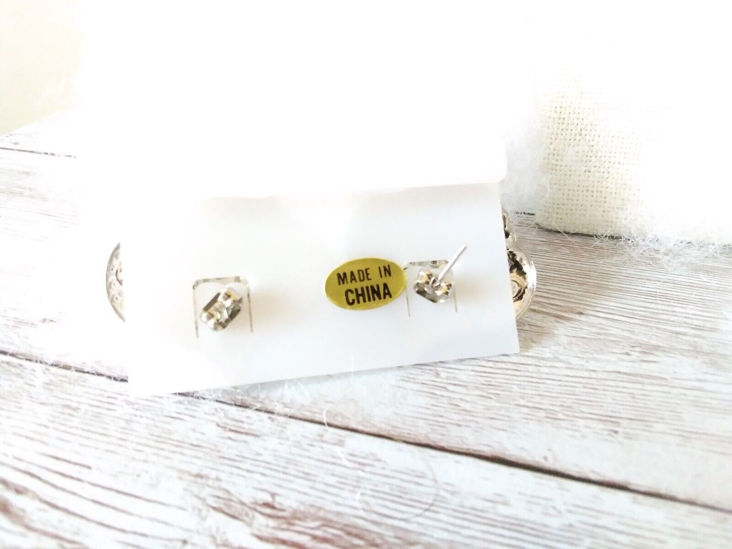 Earring backings for 1980s style heart earrings with sun symbol