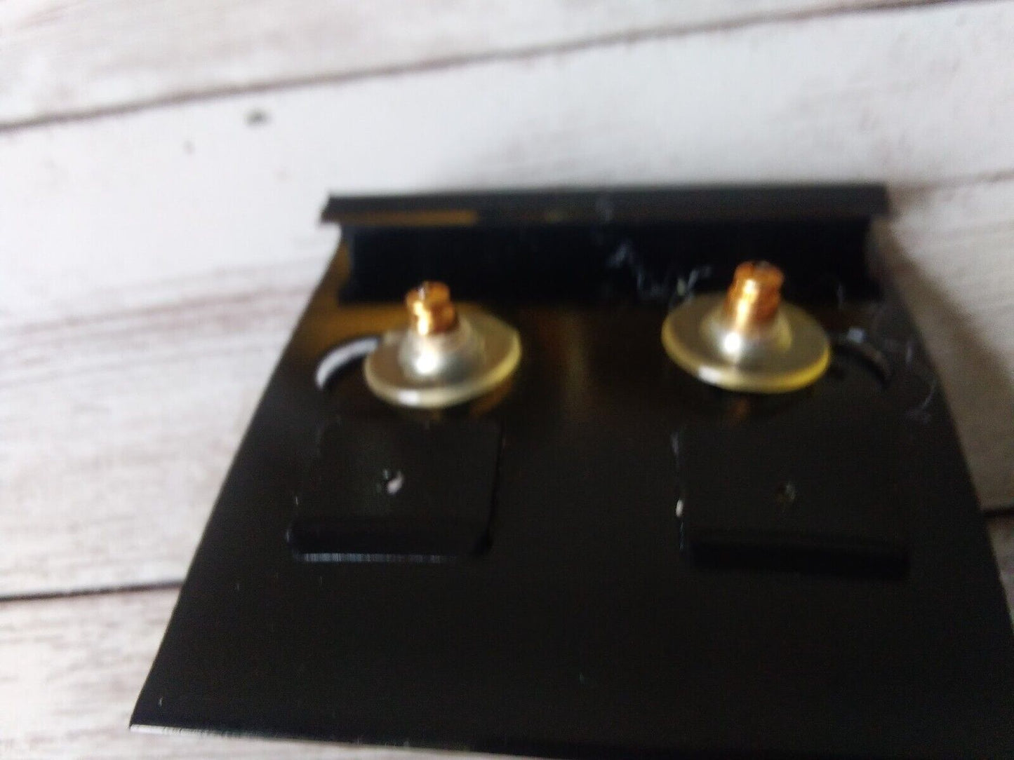 Pair of vintage orange enamel half-hoop earrings on original card back view