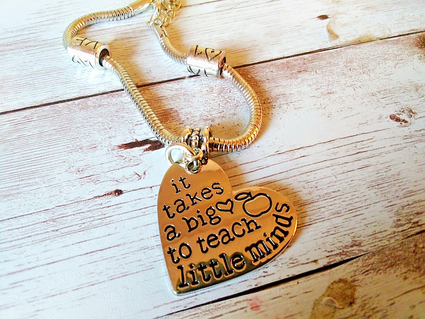 Silver-Plated Snake Chain Bracelet with reflective shine and heart charm