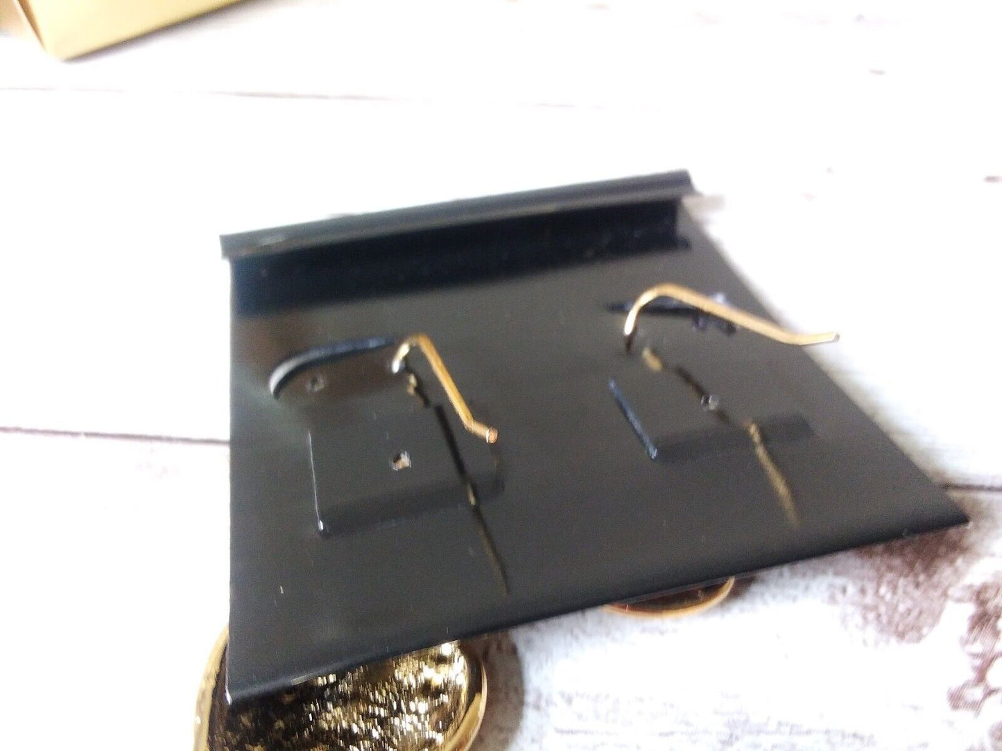 Back of original earring cards showing gold hooks