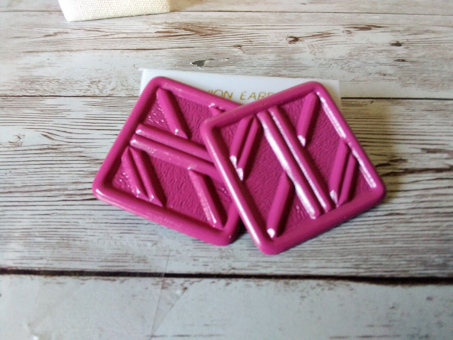 Vintage 1980s earrings with line pattern in pop pink