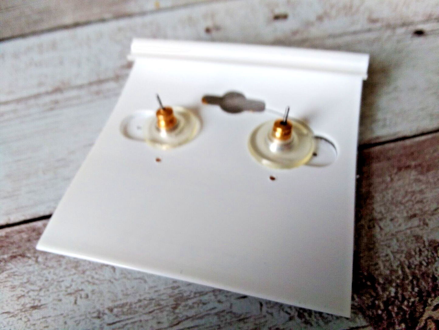 Earring backings on original card