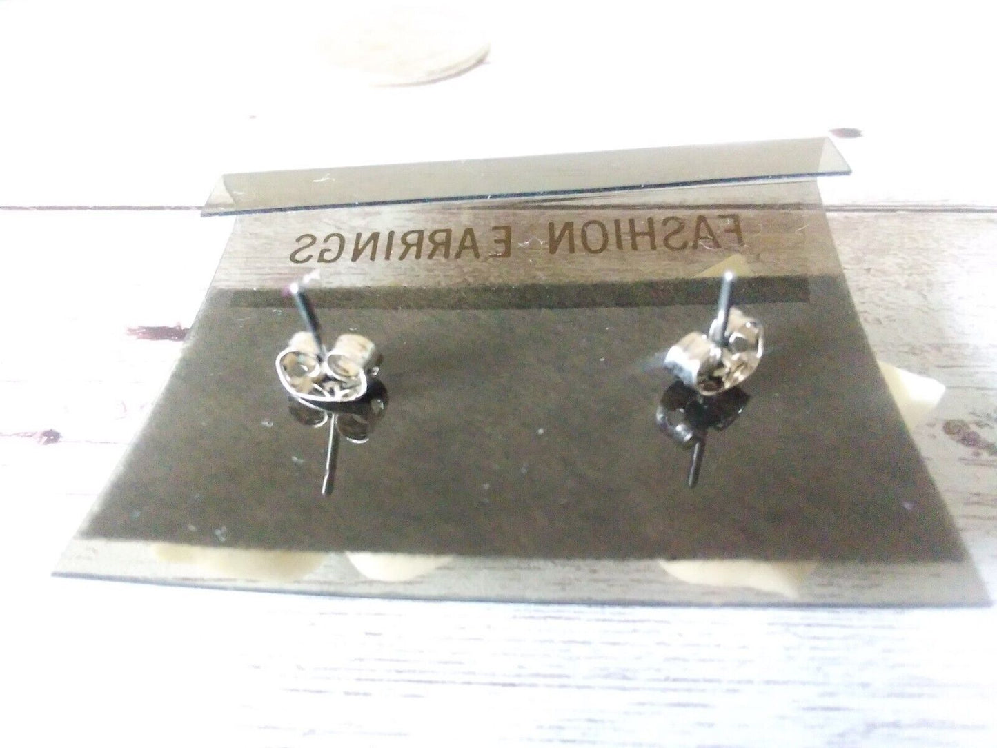 Back side of card. Resin flower earrings capturing spring elegance