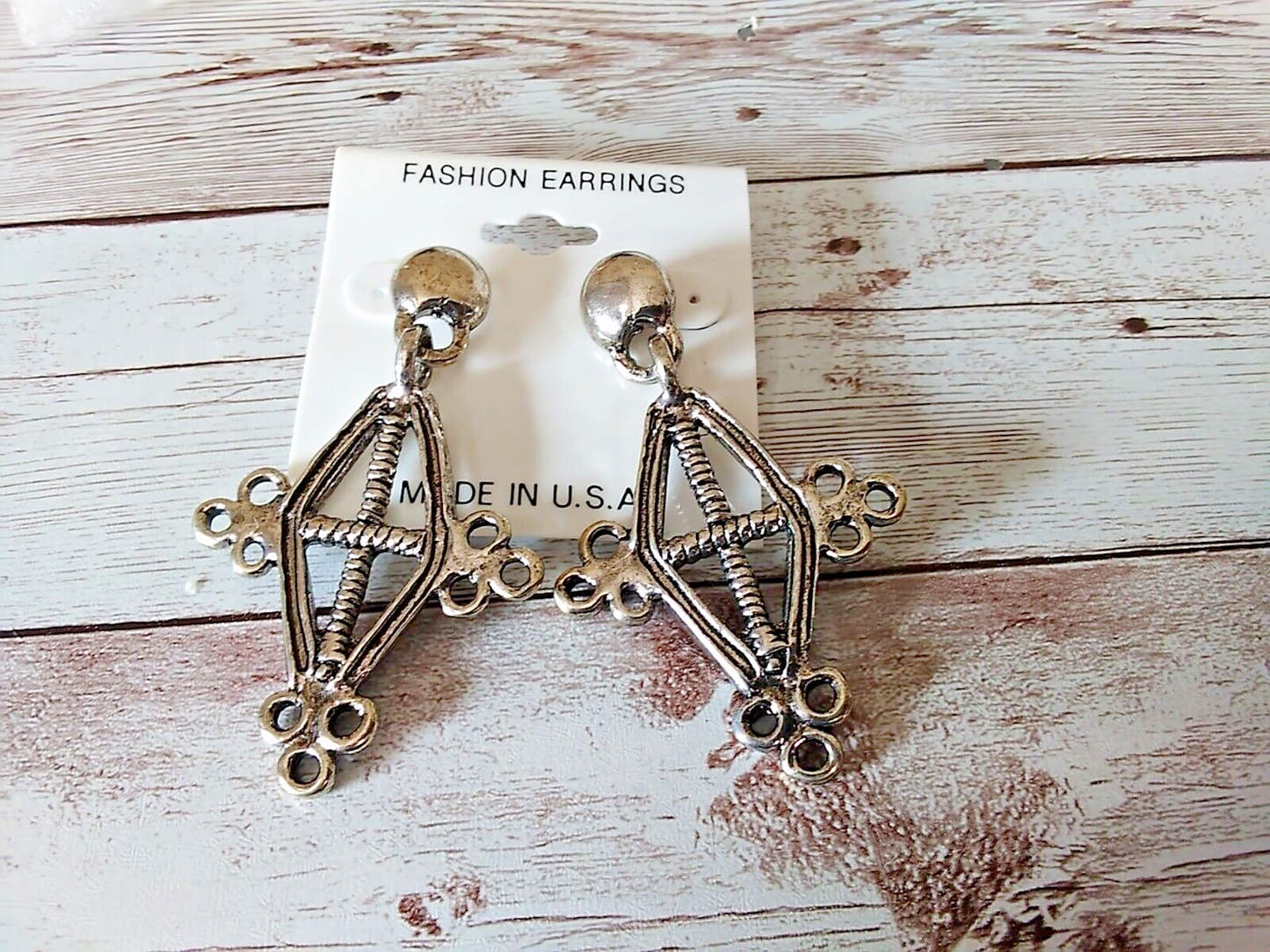Edgy punk style earrings featuring a unique cross pattern