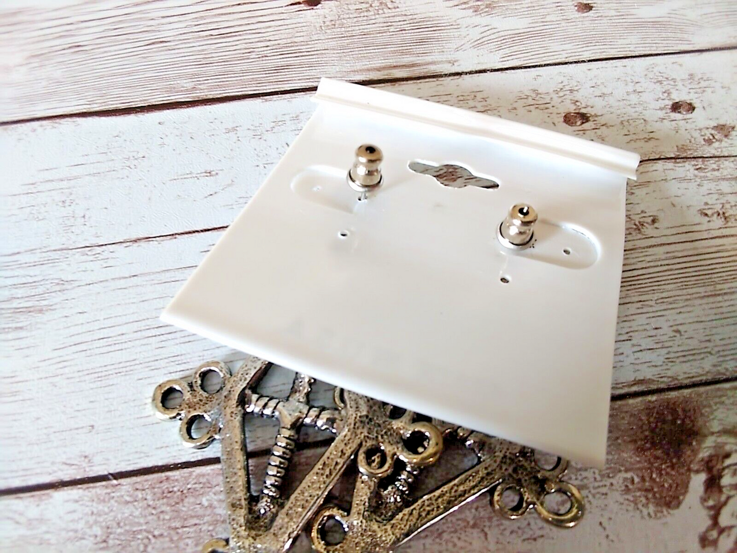 Back of earrings and earring card which is blank