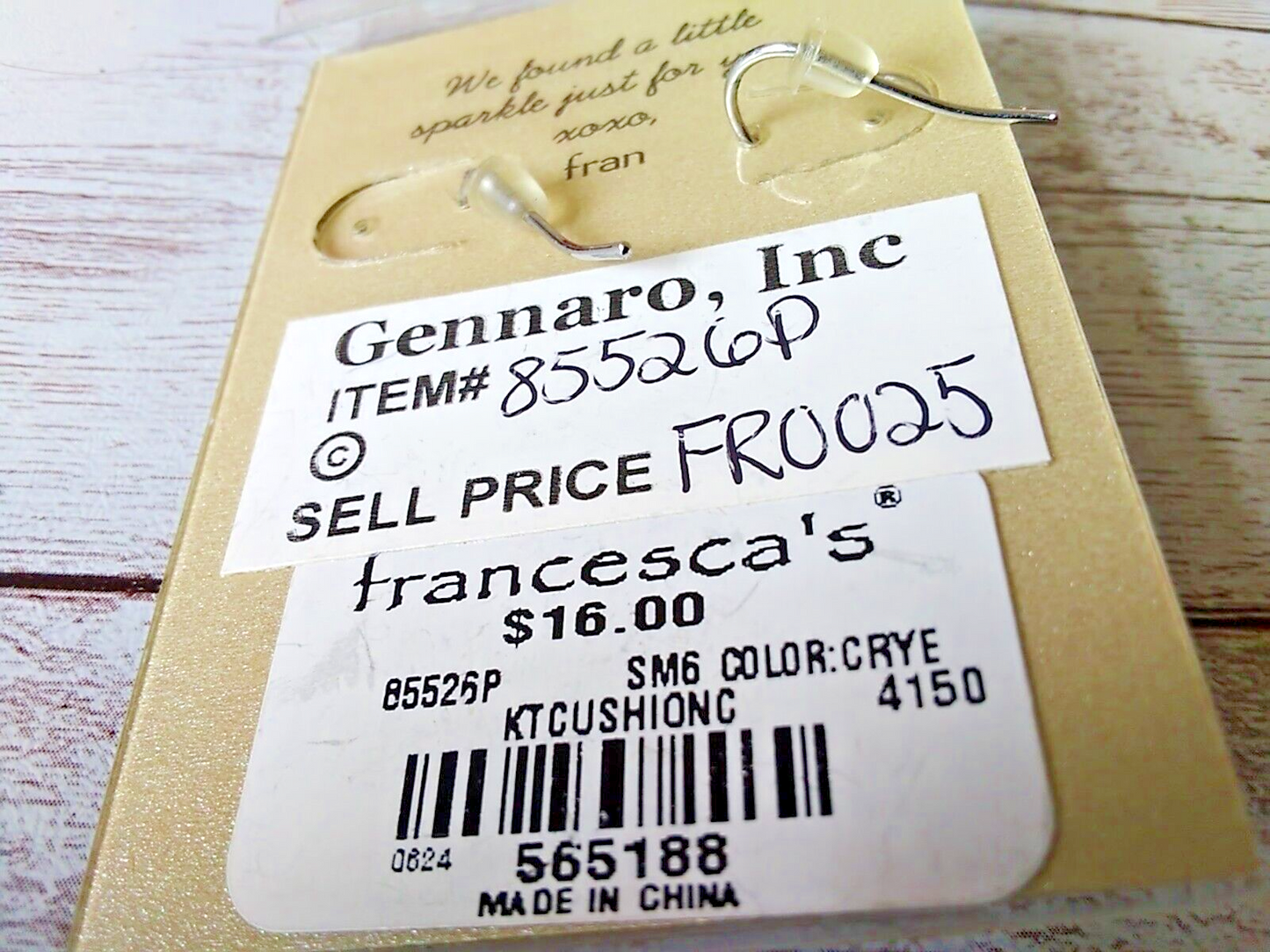 Minimalist cubic zirconia drop earrings with silver finish back of earring card