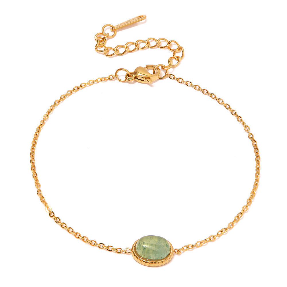 Elegant 18K gold bracelet with green stone