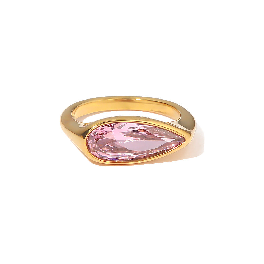 18K gold ring with simple design and pink cubic zirconia, highlighting the stone’s sparkle