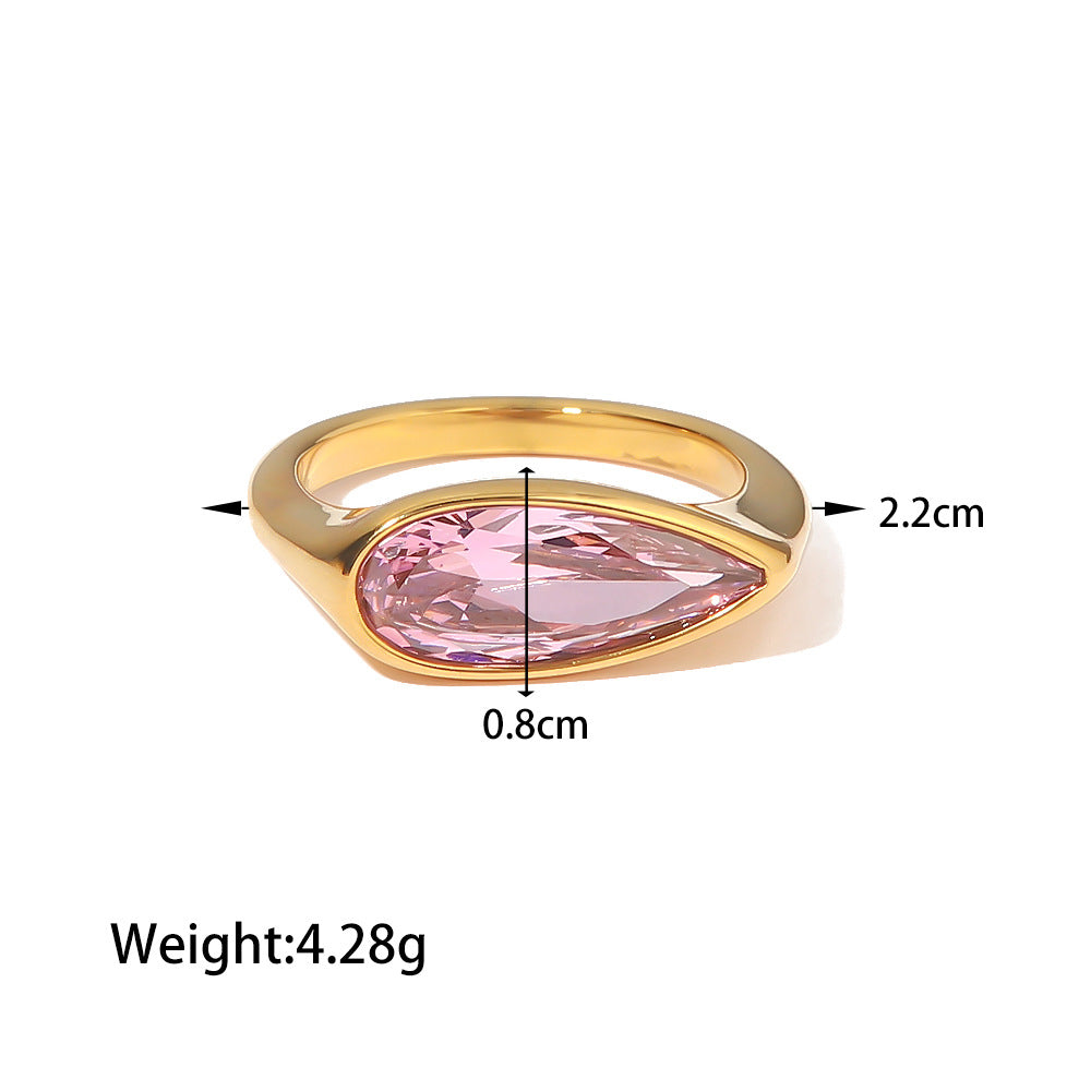 18K gold fashion ring with oval pink cubic zirconia on a white background