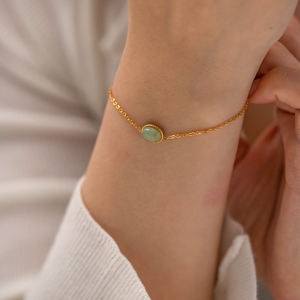 Green aventurine bracelet worn with casual outfit