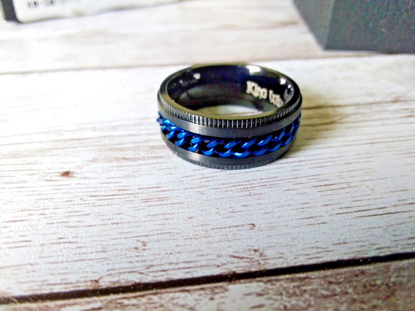 Urban Chic: Size 7 Intertwine Stainless Steel Black and Blue Spinner Ring