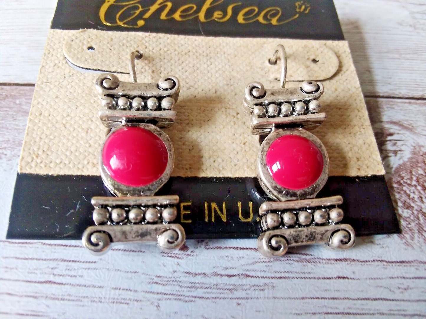 Front view of 1980s vintage silver-plated hot pink column earrings