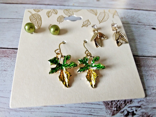 Gold tone spring garden earrings set on original card