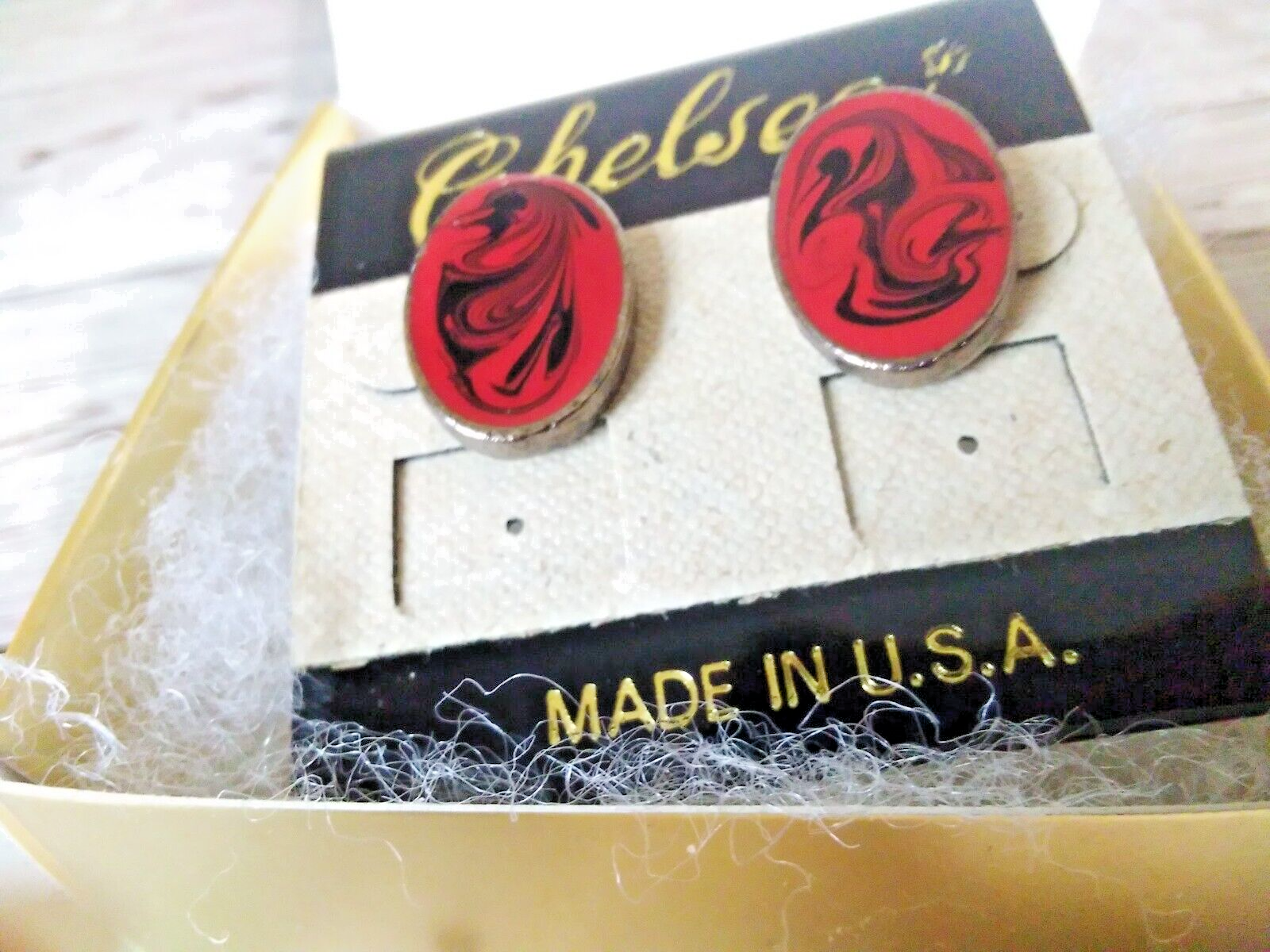 Classic vintage earrings with red and black swirl pattern in gold gift box