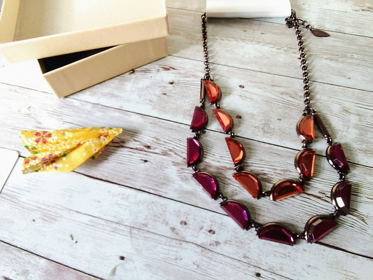 Stylish necklace with multi-colored crescent gems