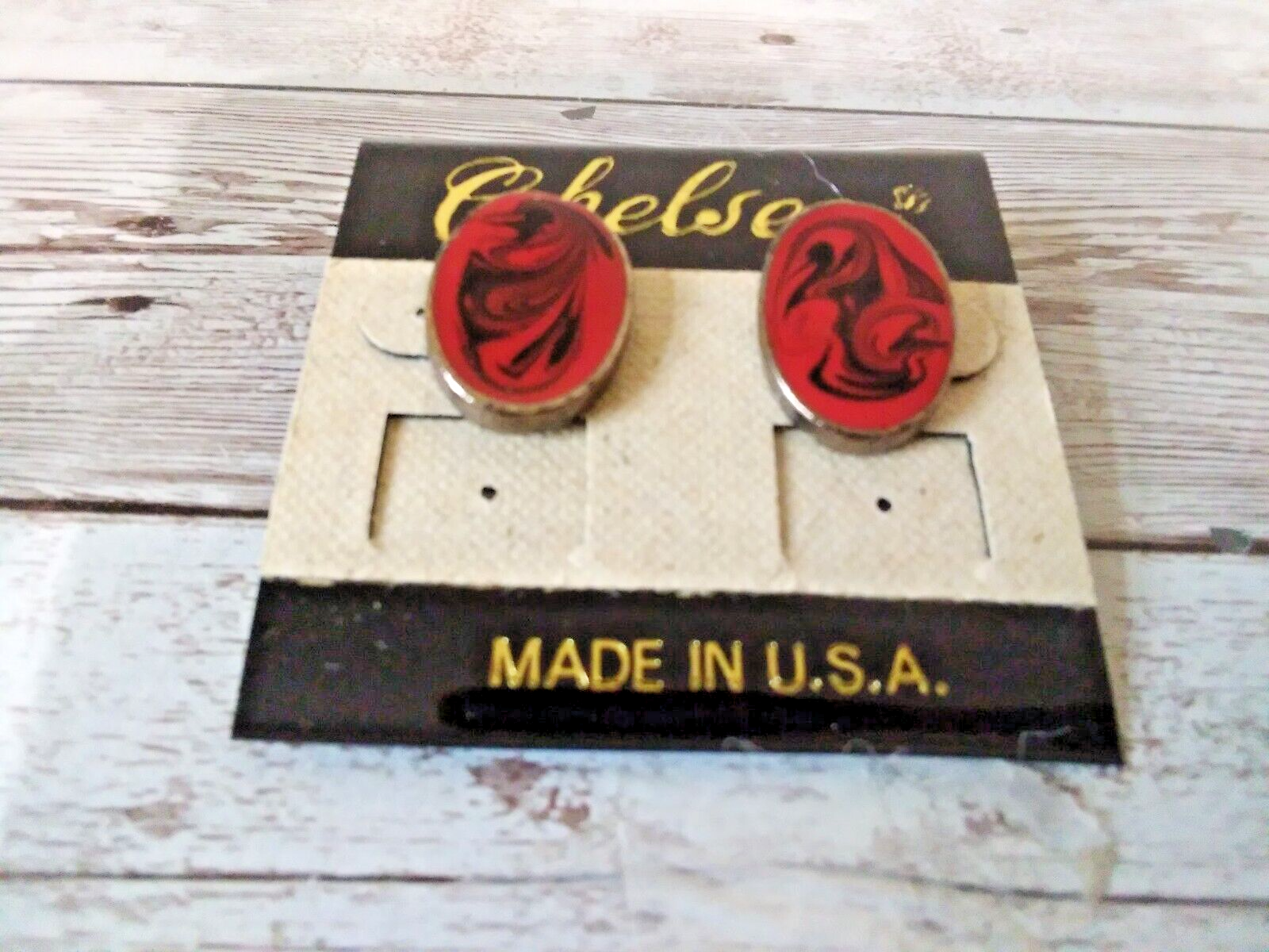 Vintage 1980s red and black swirl gold plated earrings close-up