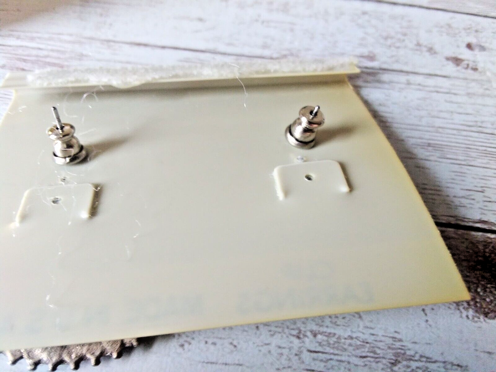 Retro dark silver and blue 1980s fan design dangle earrings back of cards