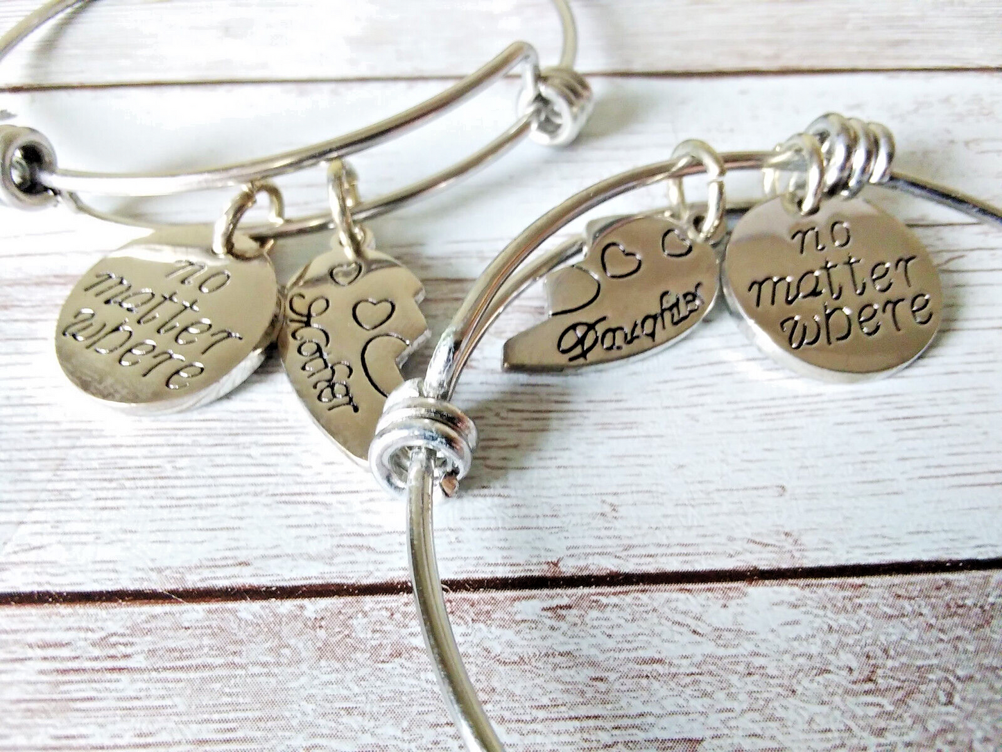 Close-up of mother-daughter matching wire bracelets