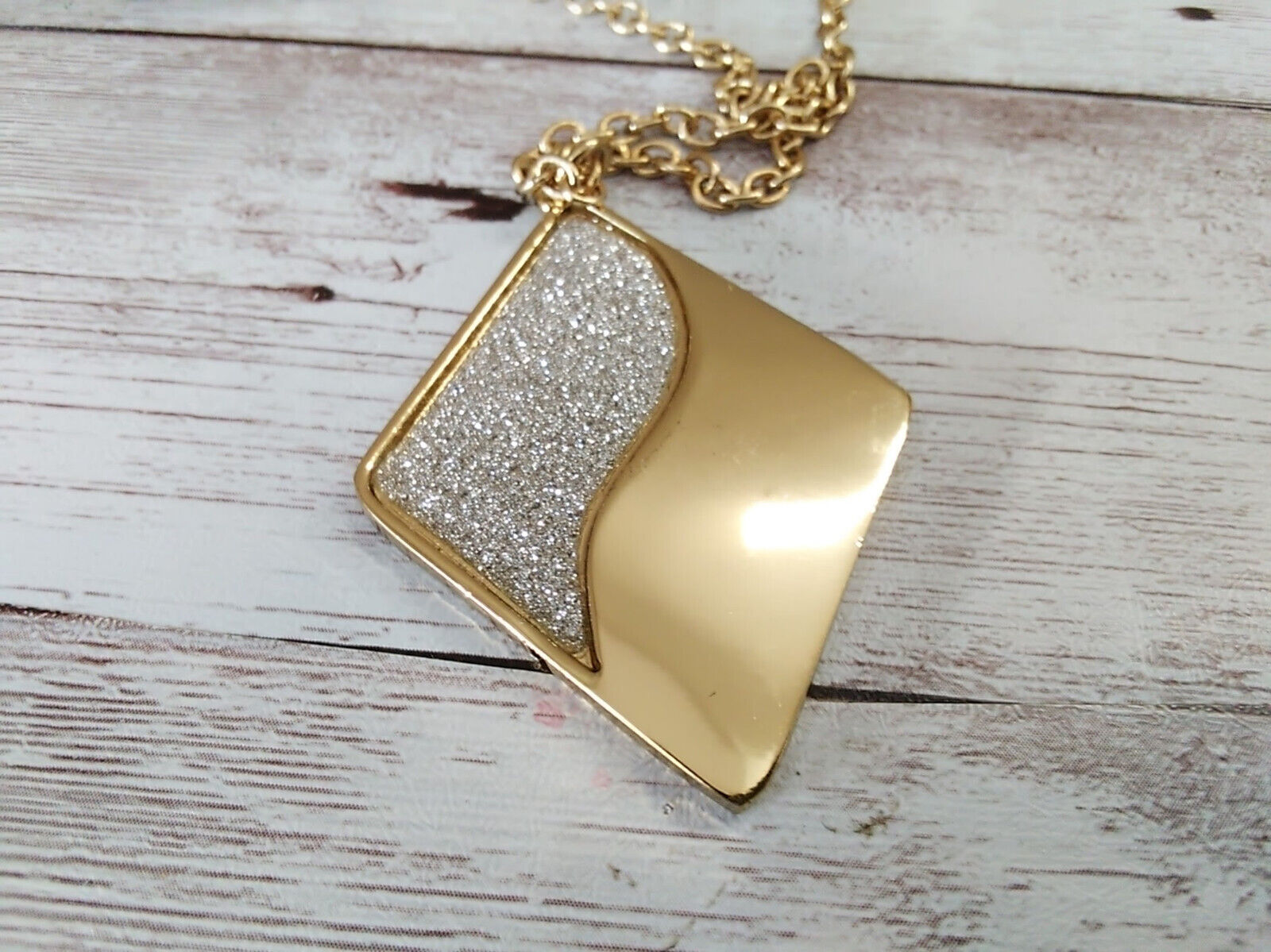 Front view of vintage 1990s diamond necklace with gold and silver glitter accents