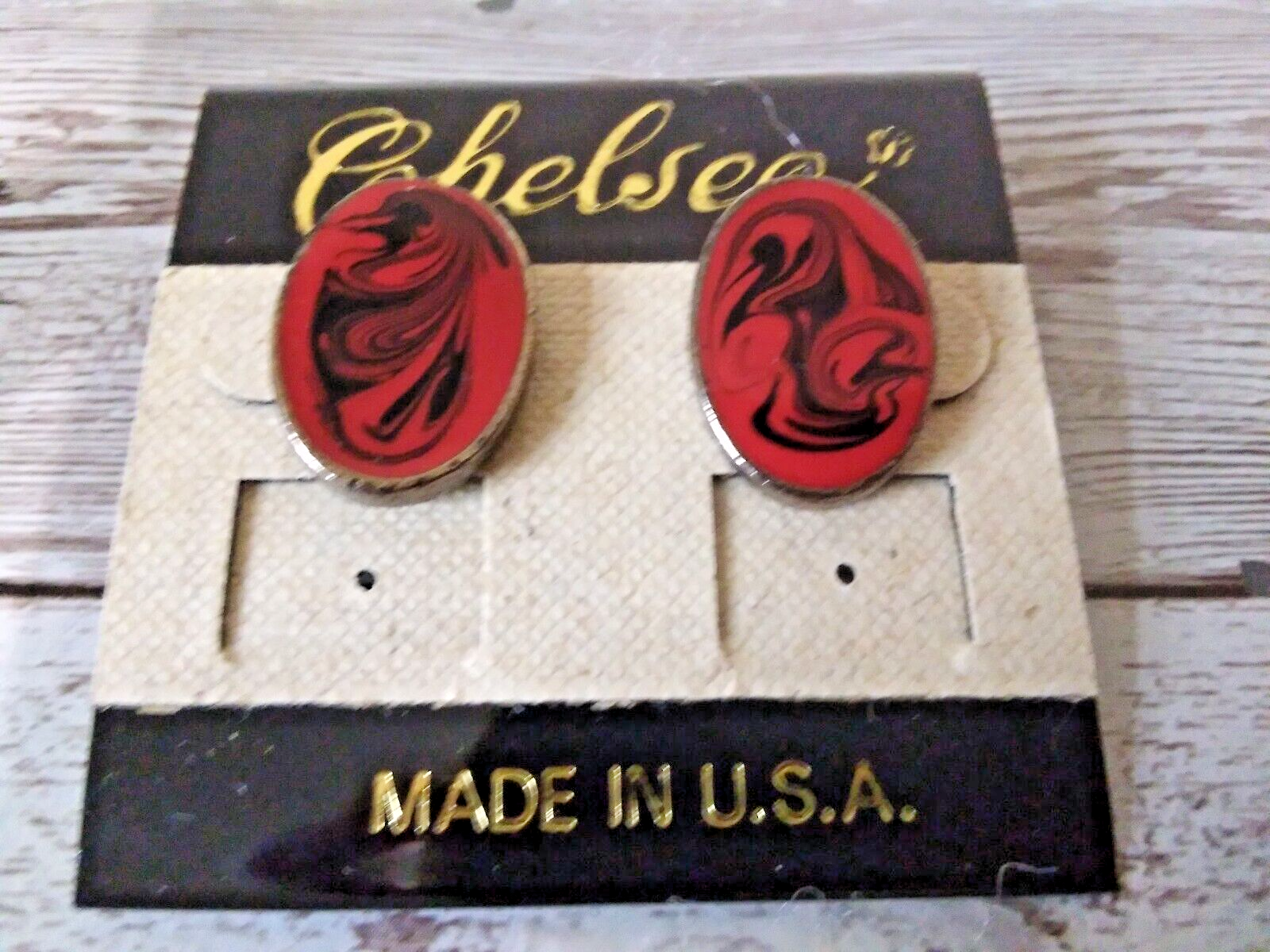 Elegant 1980s gold plated earrings with red and black swirl design