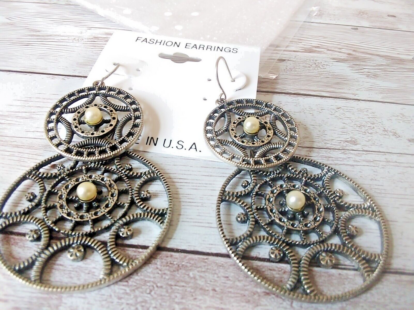 Fierce steampunk gear statement earrings close-up