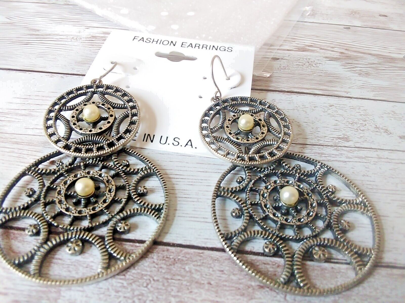 Fierce steampunk gear statement earrings close-up