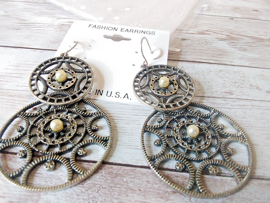 Fierce steampunk gear statement earrings close-up